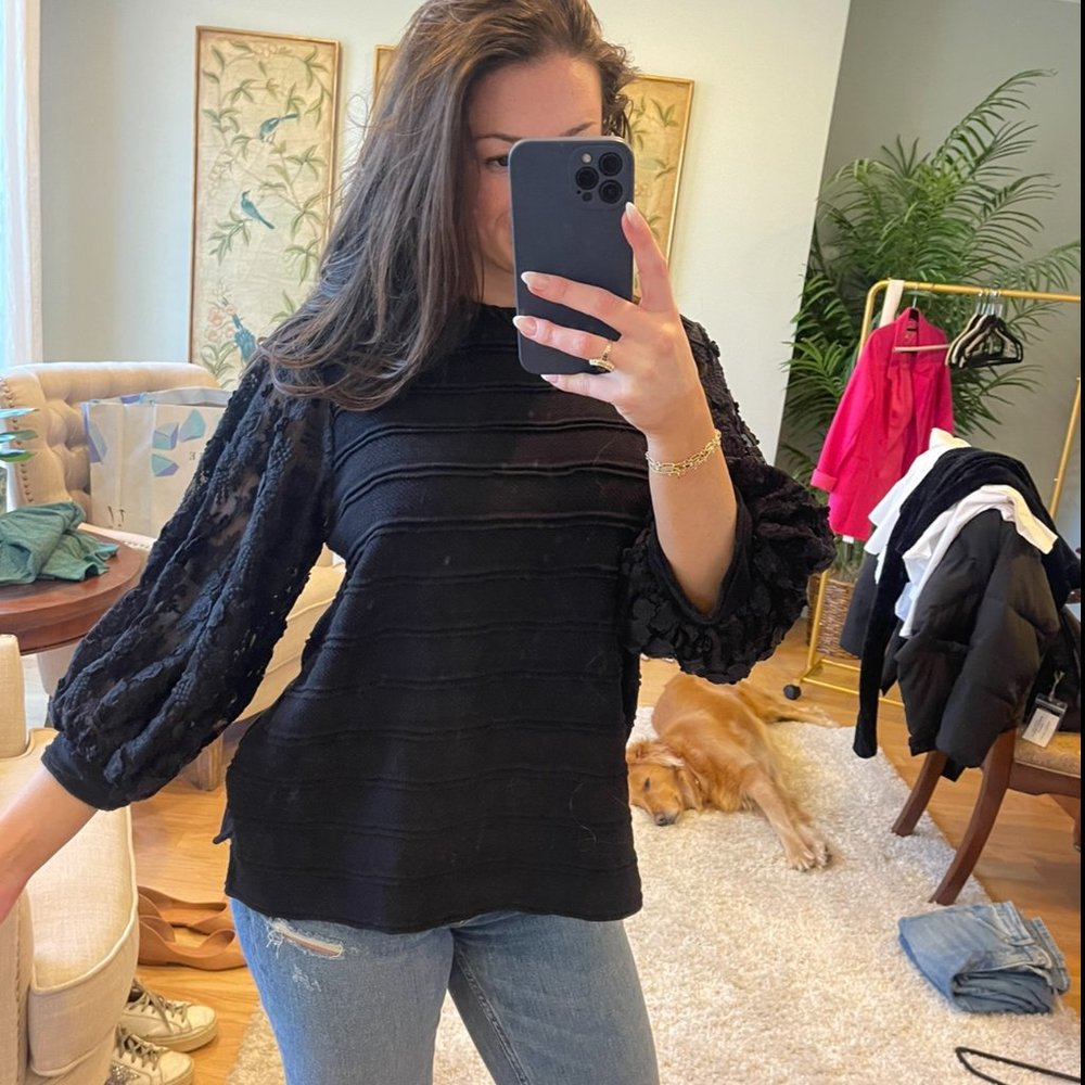Black blouse with oversized lace sleeves